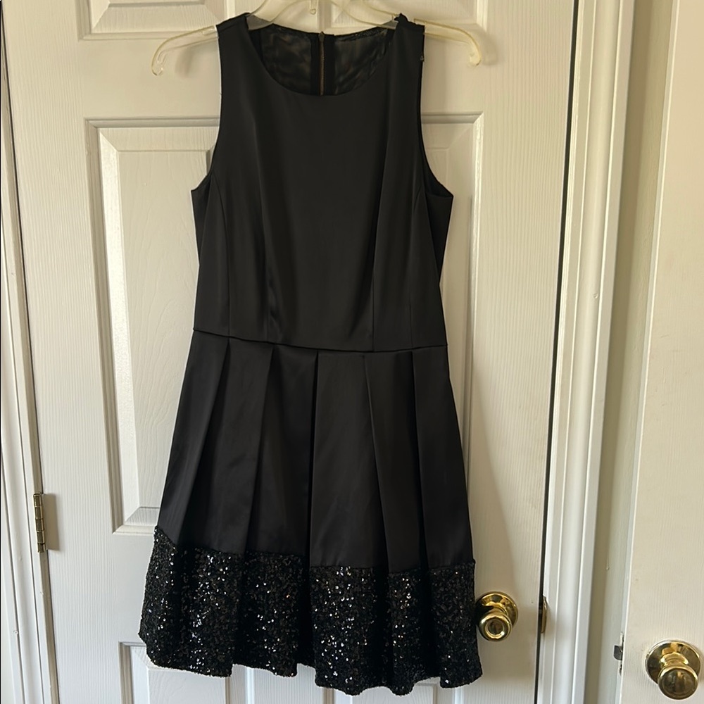 Elegant Black Satiny Dress with Sequin Hem